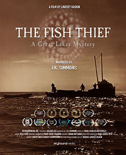 Poster for the film 'The Fish Thief: A Great Lakes Mystery,' directed by Lindsey Haskin and narrated by J.K. Simmons. The poster features a sepia-toned silhouette of two individuals on a fishing boat in the water under a cloudy sky. The title is centered, with decorative artwork resembling a fish scale pattern in the background. Multiple award laurels are displayed below the title, including recognitions from various film festivals such as the Great Lakes Environmental Film Festival and Blue Water Film Festival. The production credits include Skyhound Media, Great Lakes Fishery Commission funding, and music by Mark Charles Hattersley. The bottom text credits the film to Skyhound Media.